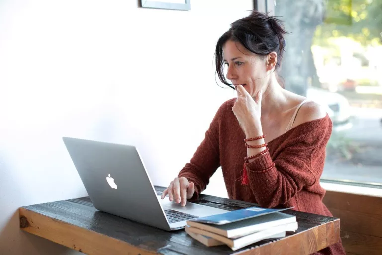 woman sat at desk during online EMDR therapy session