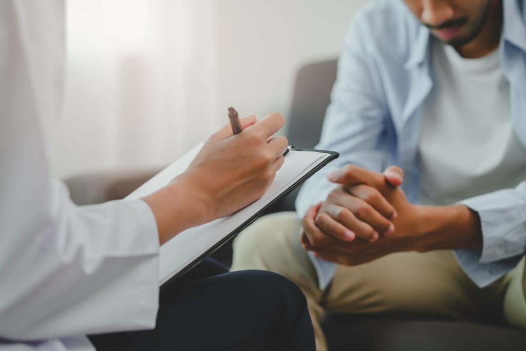 man sat during counselling