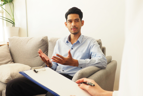 young man in therapy having cbt